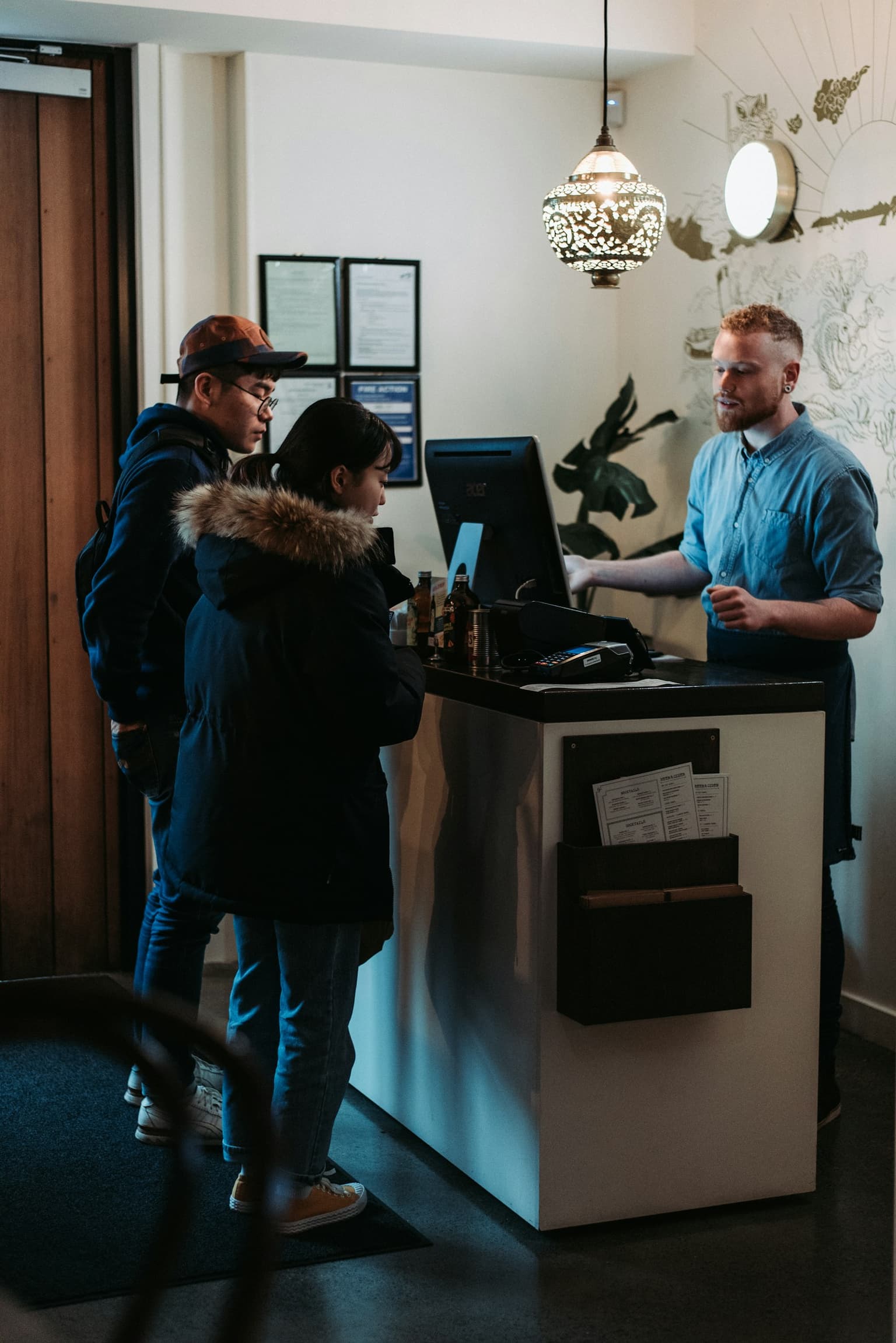 Guests welcomed at a hotel front desk